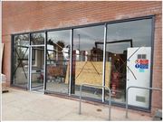 Giant Shopfront Shutter - Toughened glass and timber shopfront